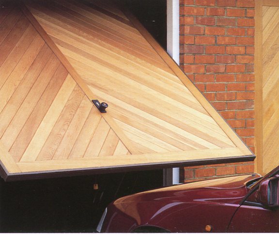 Hormann Chevron timber door with visible chassis powder coated in dark brown.